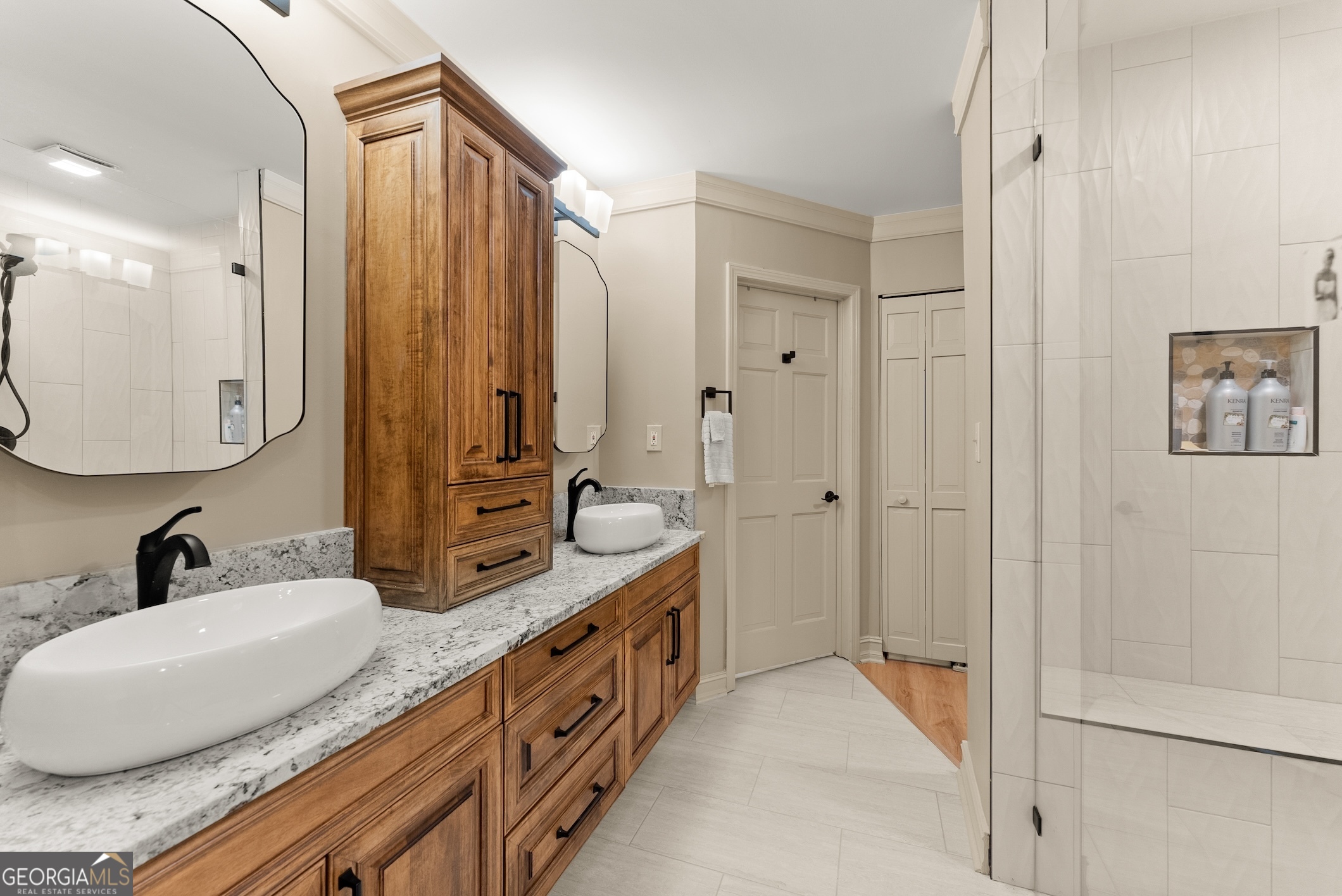 7215 Kelly Bridge Road Dawsonville, GA 30534 - Photo 24 of 81 a bathroom with double vanity and a mirror