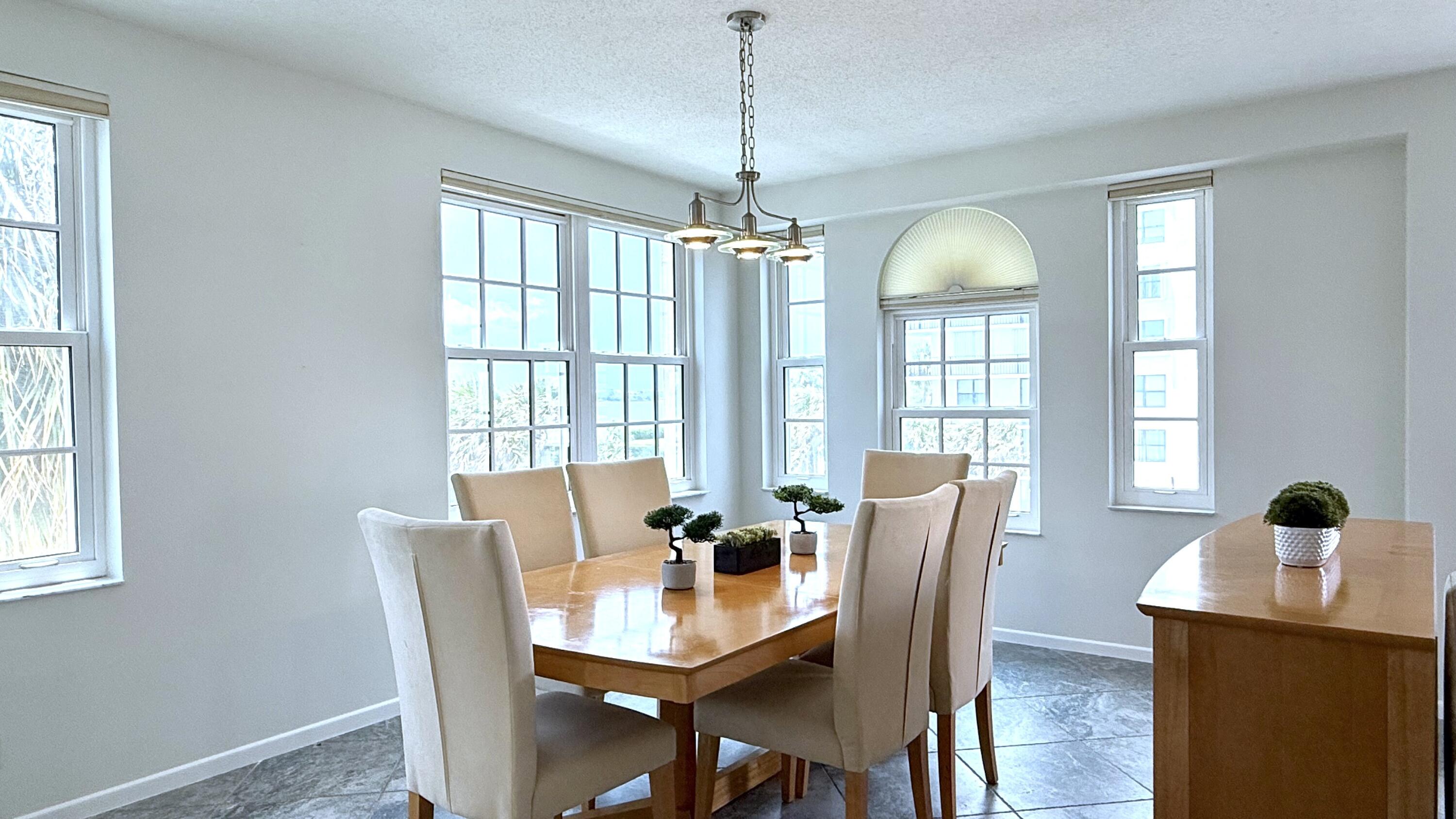 3475 South Ocean Boulevard, Unit 2160 Palm Beach, FL 33480 - Photo 12 of 54 a view of a dining room with furniture window and wooden floor