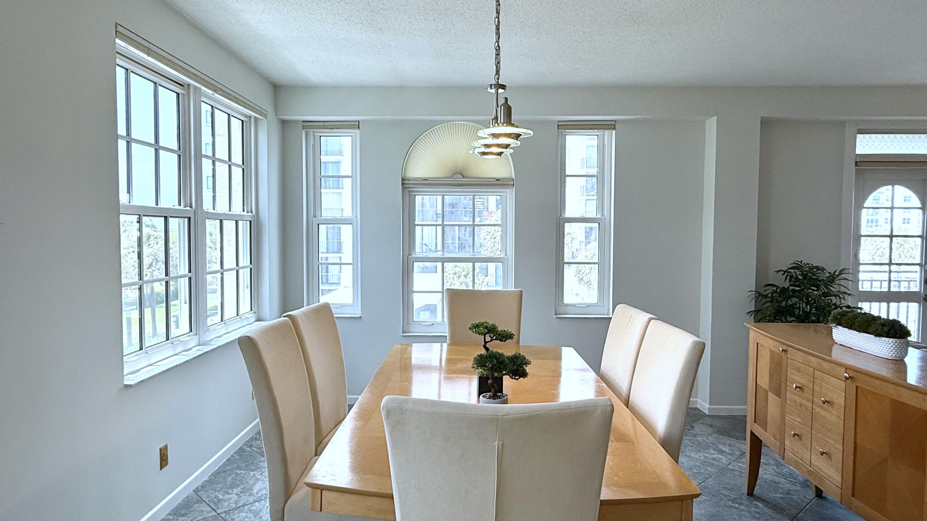 3475 South Ocean Boulevard, Unit 2160 Palm Beach, FL 33480 - Photo 13 of 54 a view of a dining room with furniture window and wooden floor