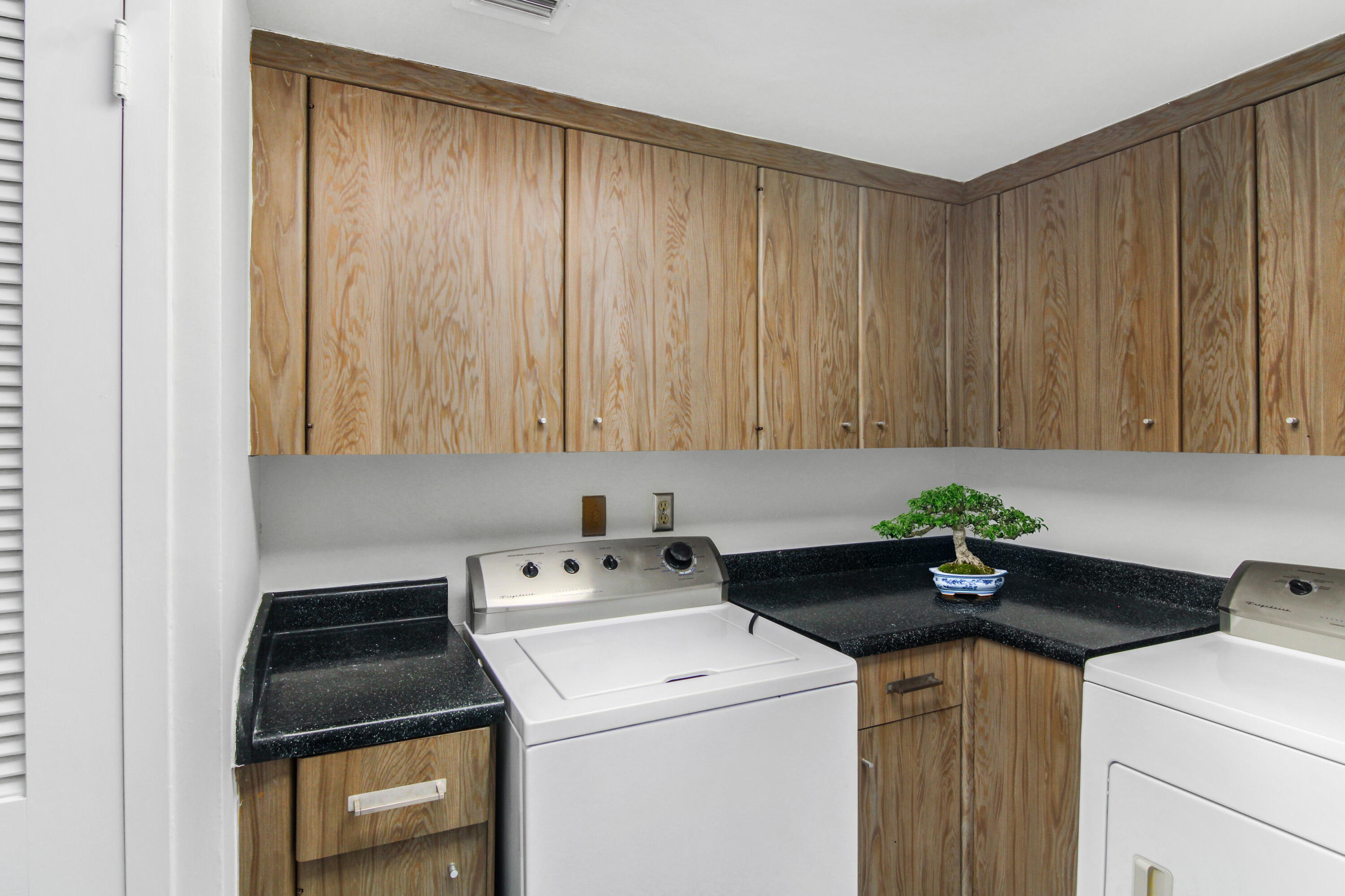 3475 South Ocean Boulevard, Unit 2160 Palm Beach, FL 33480 - Photo 20 of 54 a utility room with dryer and washer