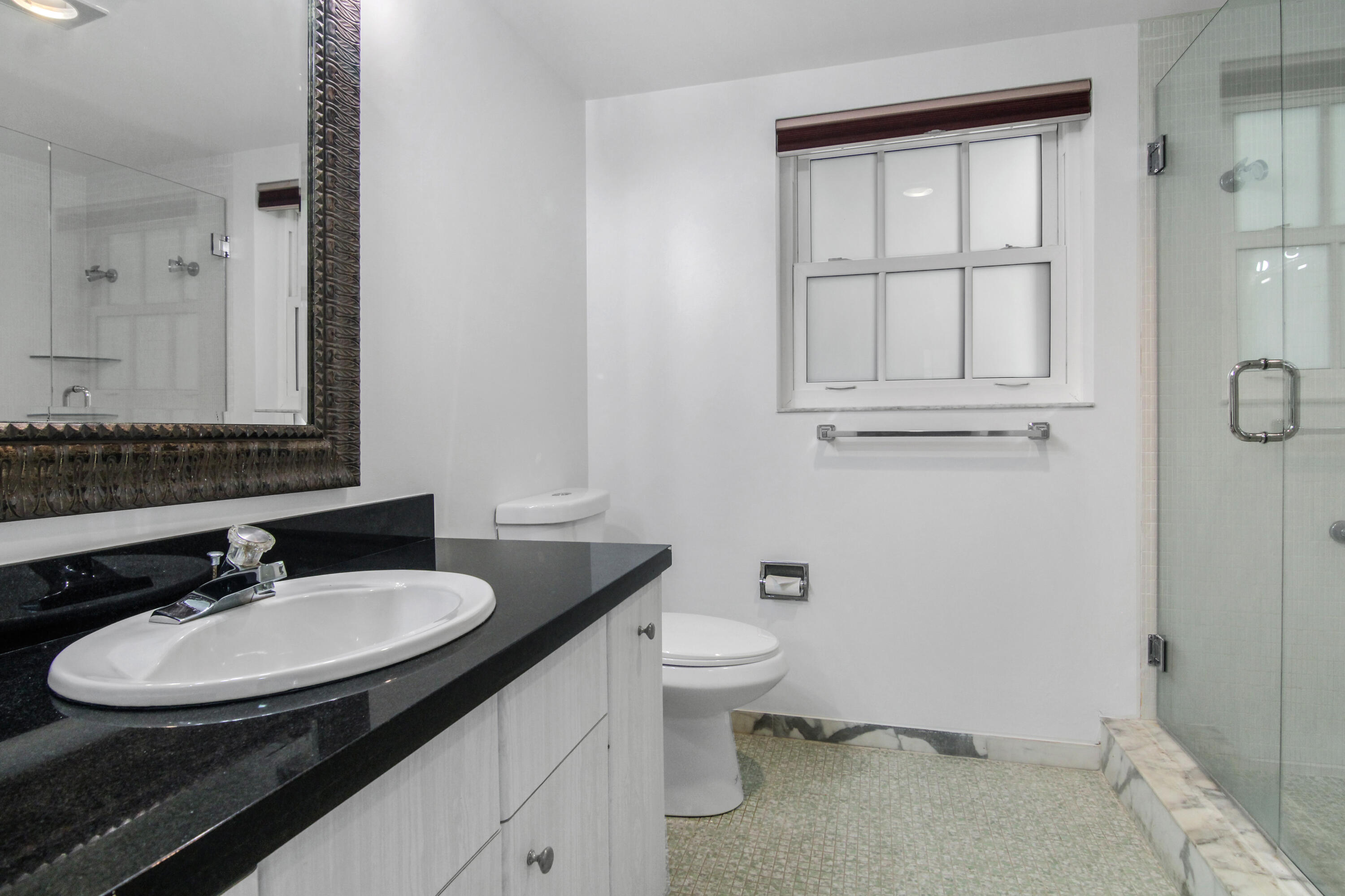 3475 South Ocean Boulevard, Unit 2160 Palm Beach, FL 33480 - Photo 23 of 54 a bathroom with a sink and a toilet