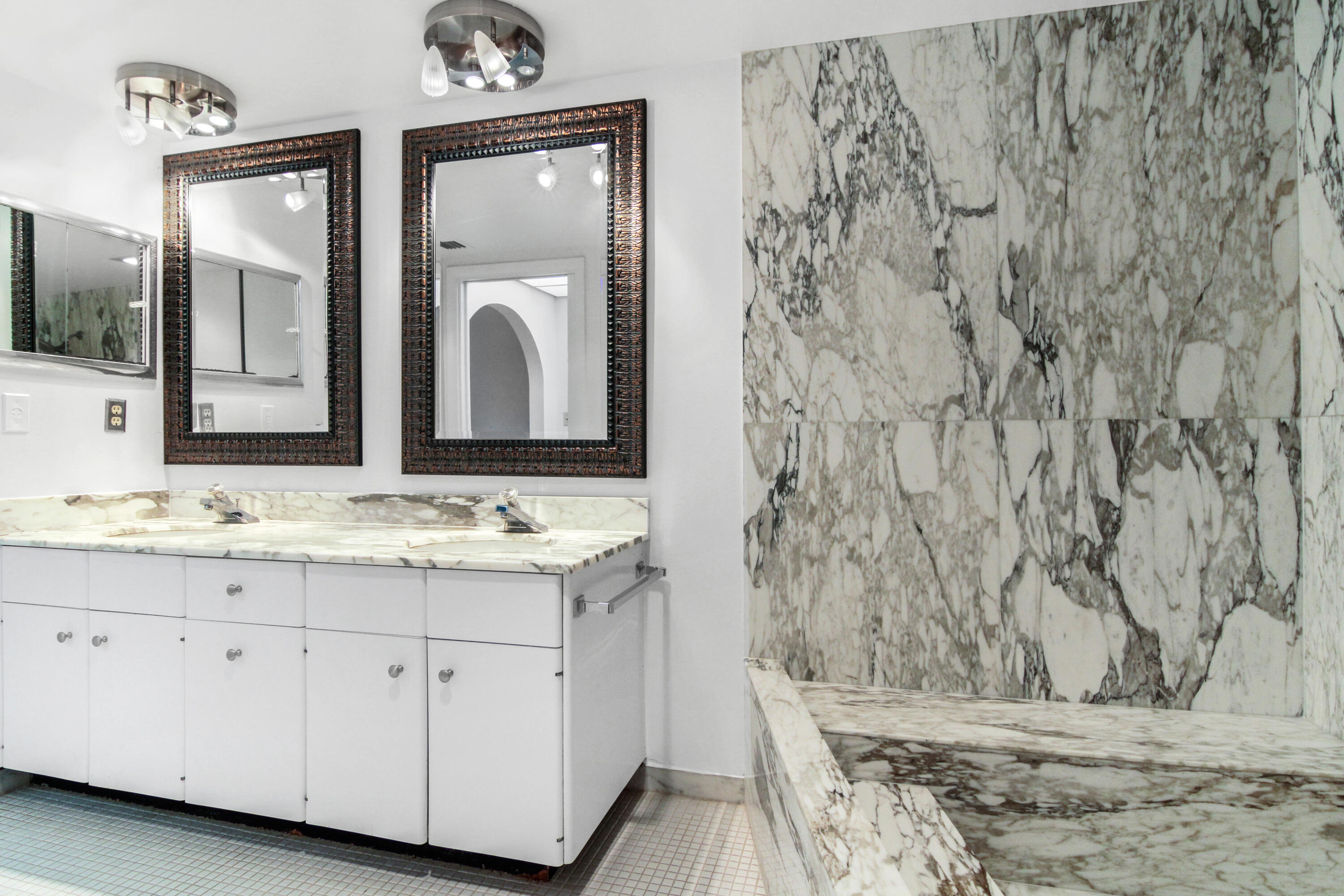 3475 South Ocean Boulevard, Unit 2160 Palm Beach, FL 33480 - Photo 30 of 54 a bathroom with a granite countertop sink and a mirror