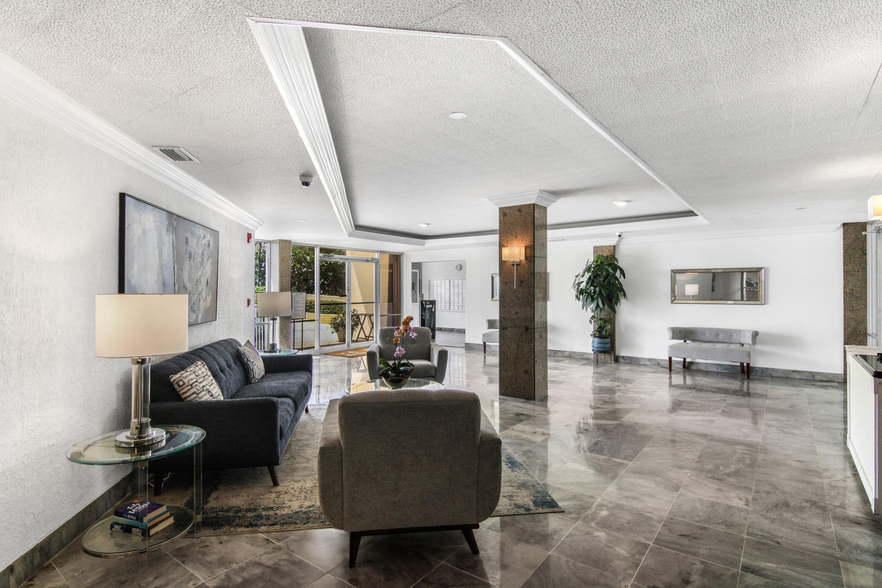 3475 South Ocean Boulevard, Unit 2160 Palm Beach, FL 33480 - Photo 38 of 54 a living room with furniture and a potted plant