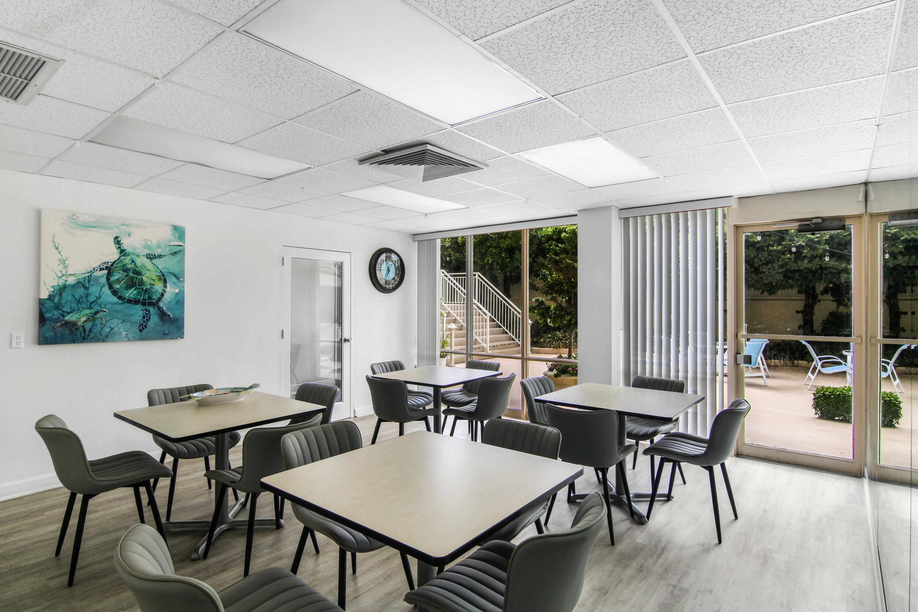 3475 South Ocean Boulevard, Unit 2160 Palm Beach, FL 33480 - Photo 41 of 54 a view of a dining room with furniture large windows and wooden floor