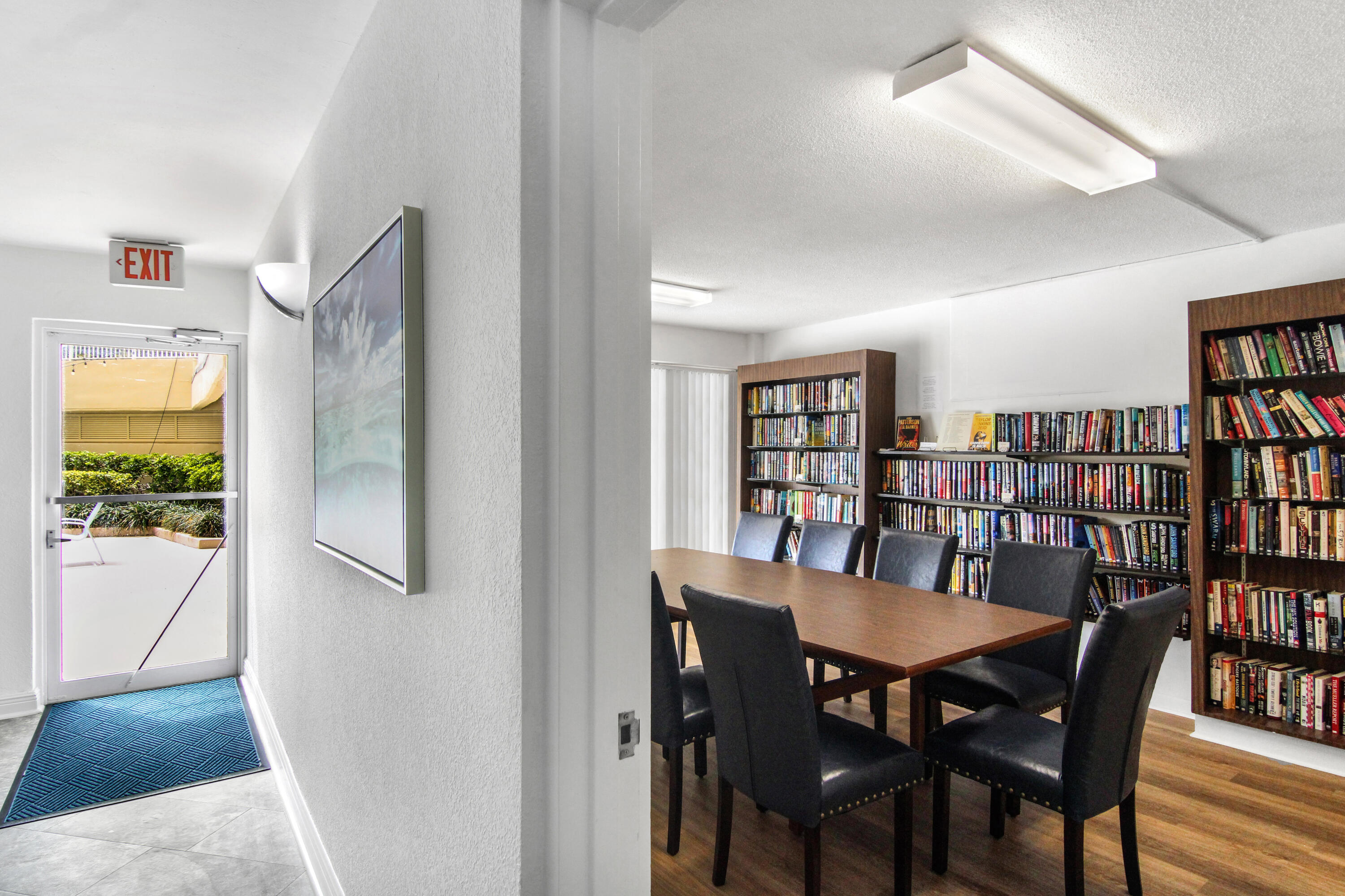 3475 South Ocean Boulevard, Unit 2160 Palm Beach, FL 33480 - Photo 42 of 54 a view of a dining room with furniture and a book shelf