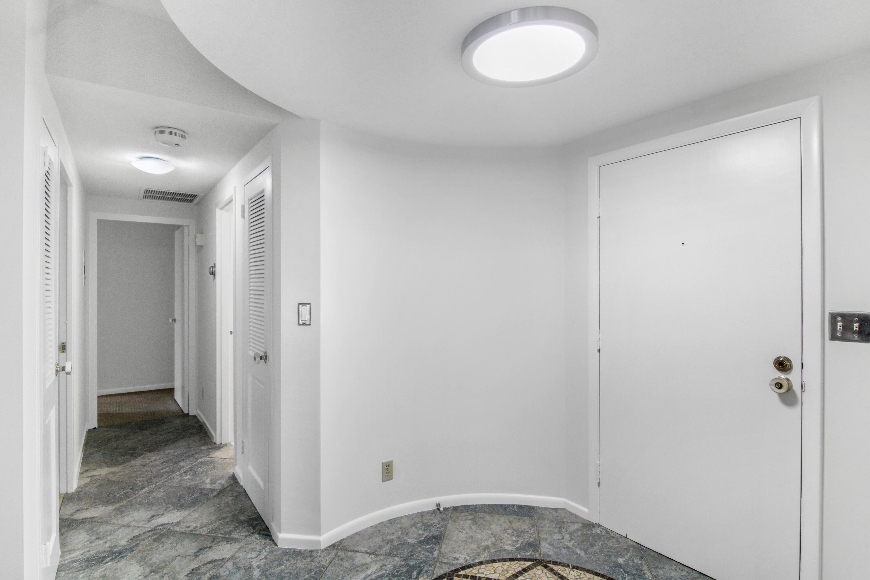3475 South Ocean Boulevard, Unit 2160 Palm Beach, FL 33480 - Photo 5 of 54 a view of a hallway with a room