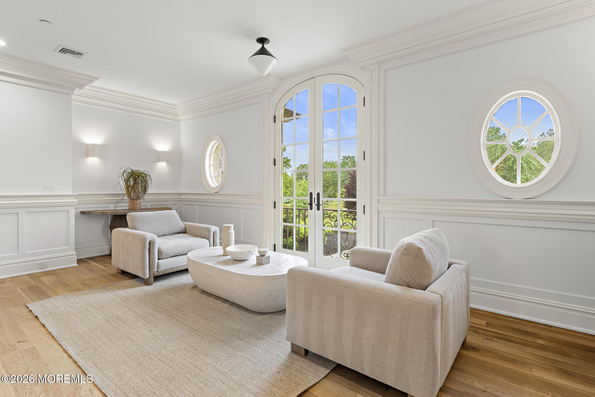 88 Montrose Road Colts Neck, NJ 07722 - Photo 31 of 73 a living room with furniture a window and a chandelier