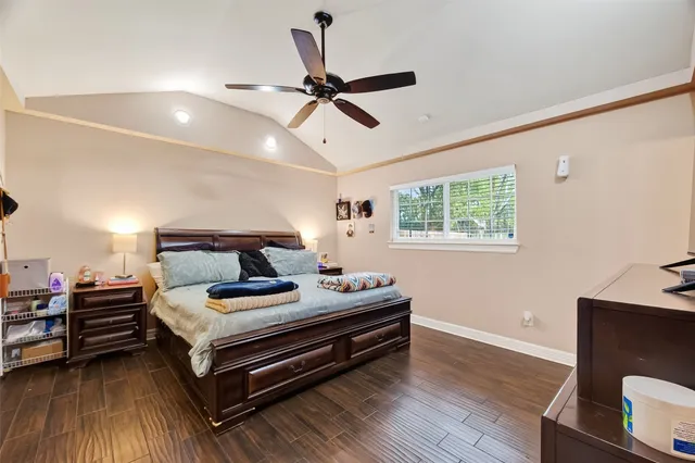 a bedroom with bed and window