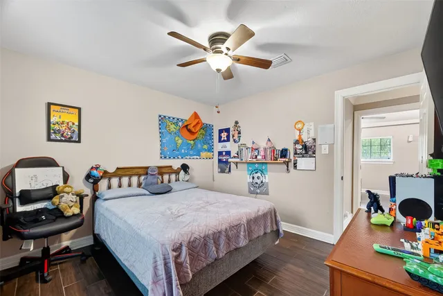 a bedroom with a bed and a table in it