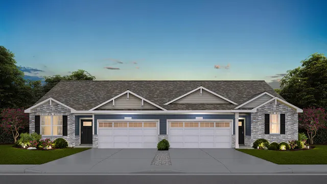 a view of a white house next to a yard