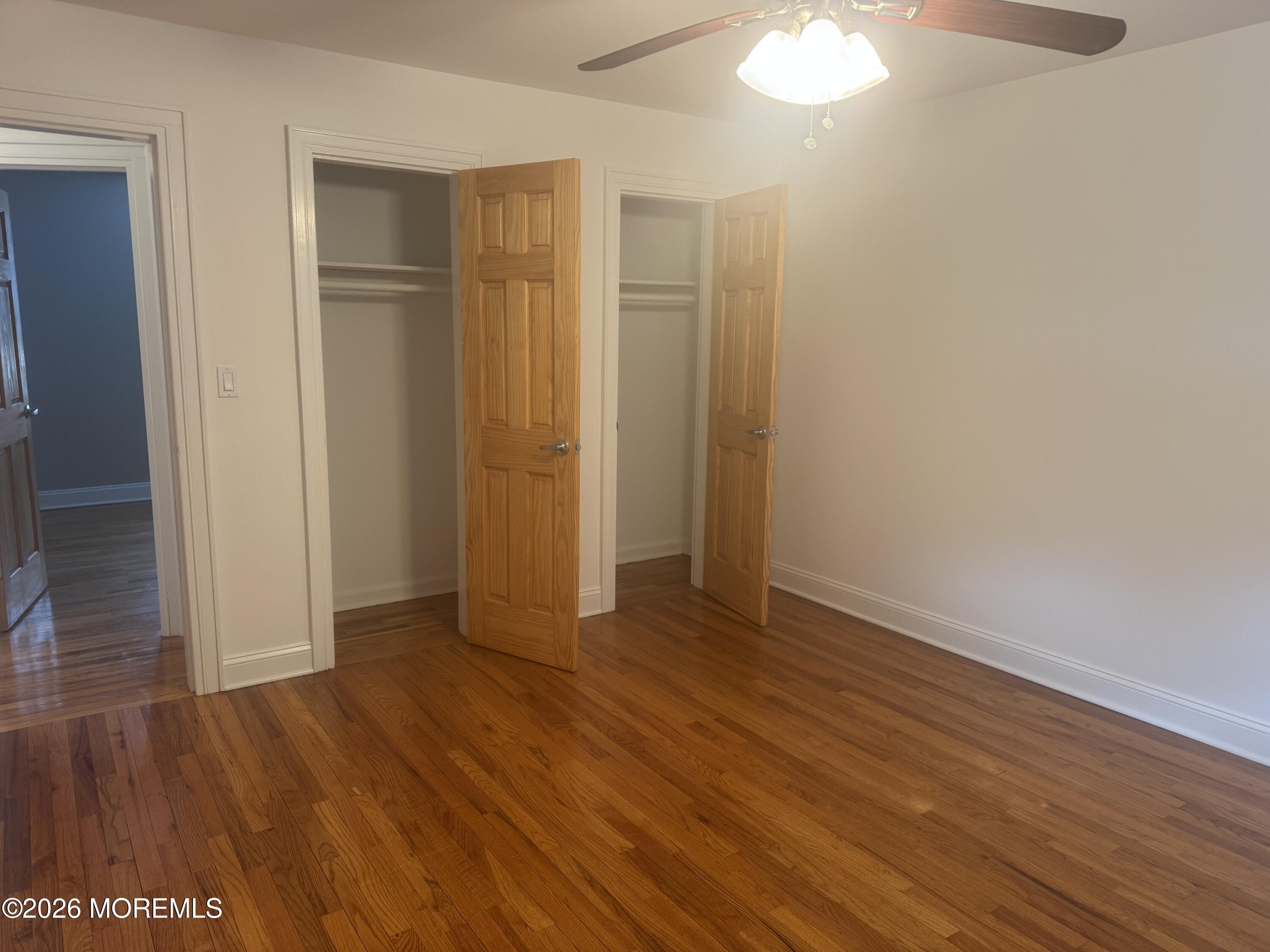 283 Spring Street, Unit 5B Red Bank, NJ 07701 - Photo 15 of 18 a view of an empty room with wooden floor