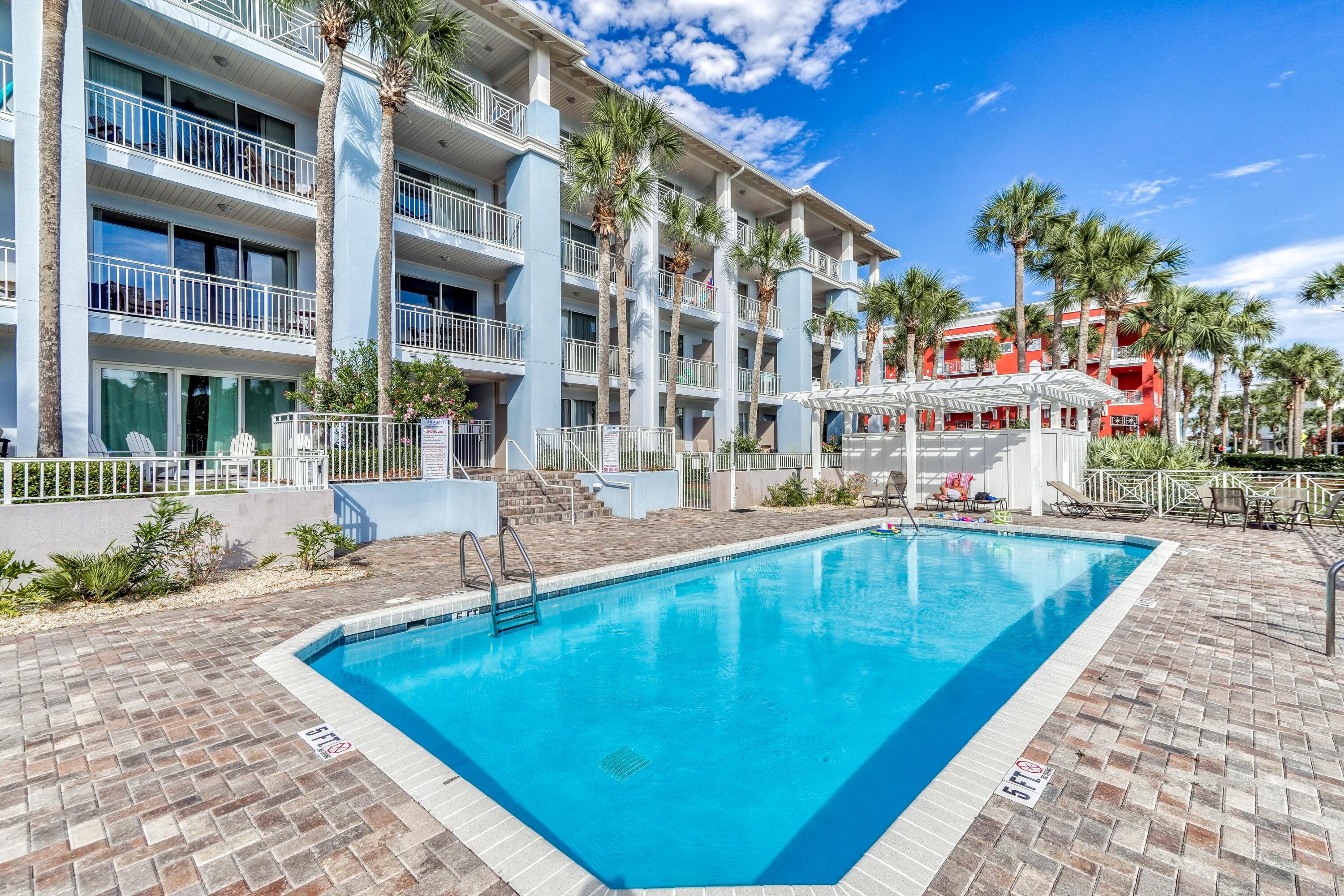 145 Spires Lane, Unit 406 Santa Rosa Beach, FL 32459 - Photo 24 of 38 a swimming pool with buildings in the background