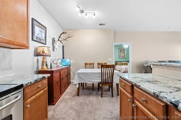 a view of a kitchen with granite countertop breakfast area