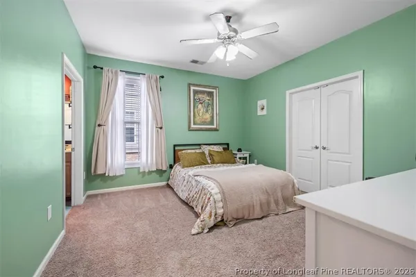 a bed room with a bed and a chandelier