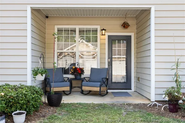 a backyard of a house with outdoor seating