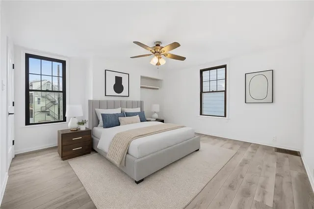 a bedroom with a bed and window