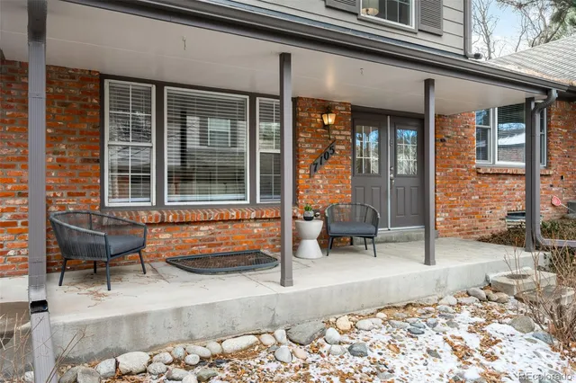 a outdoor living area with furniture and a window