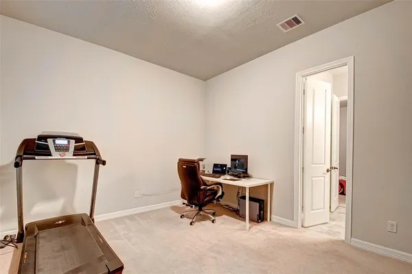 a view of a workspace with furniture