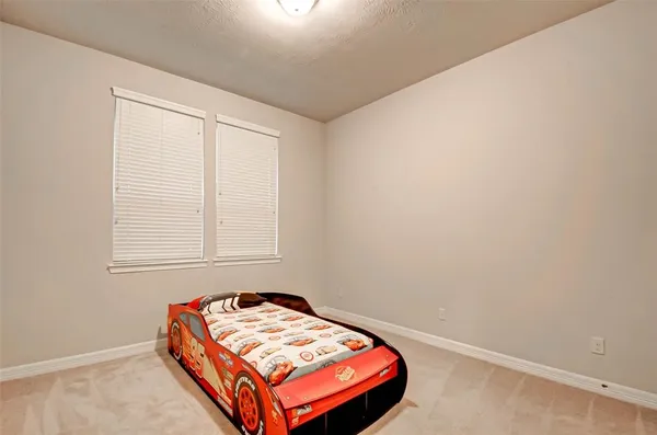 a room with a bed and a window