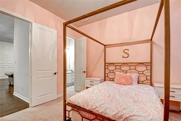 a bedroom with a bed and a mirror