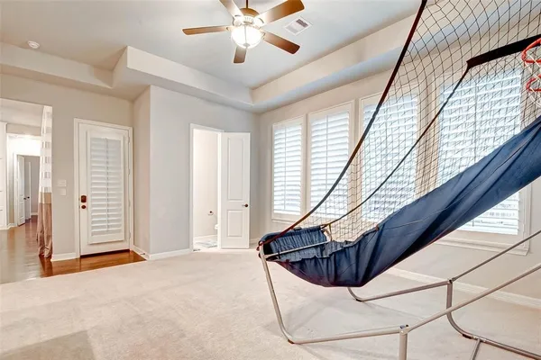 a bedroom with a large bed and a large window