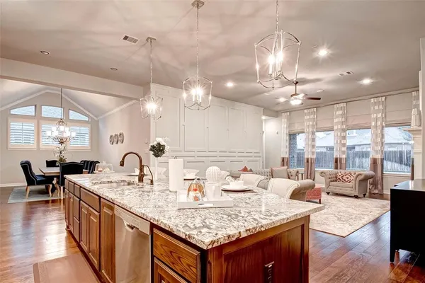 a view of a kitchen counter space dining table and chairs