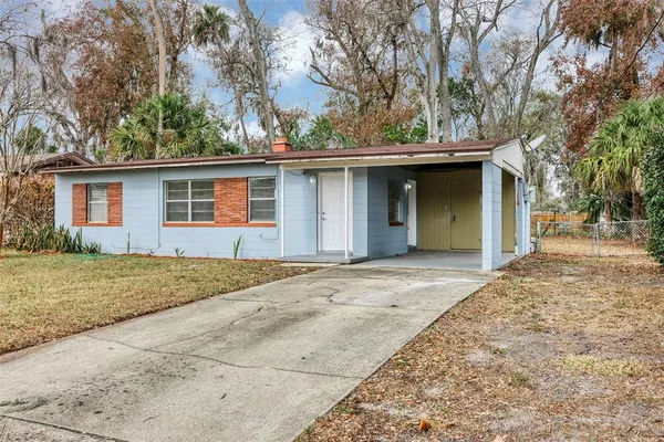 a house with trees in the background