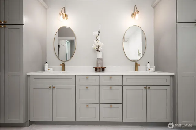 a bathroom with a double vanity sink and a mirror