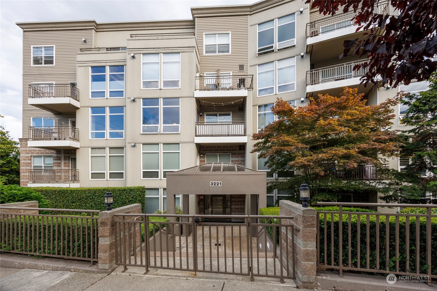 3221 Southwest Avalon Way, Unit 305 Seattle, WA 98126 - Photo 1 of 40 front view of a house with a balcony