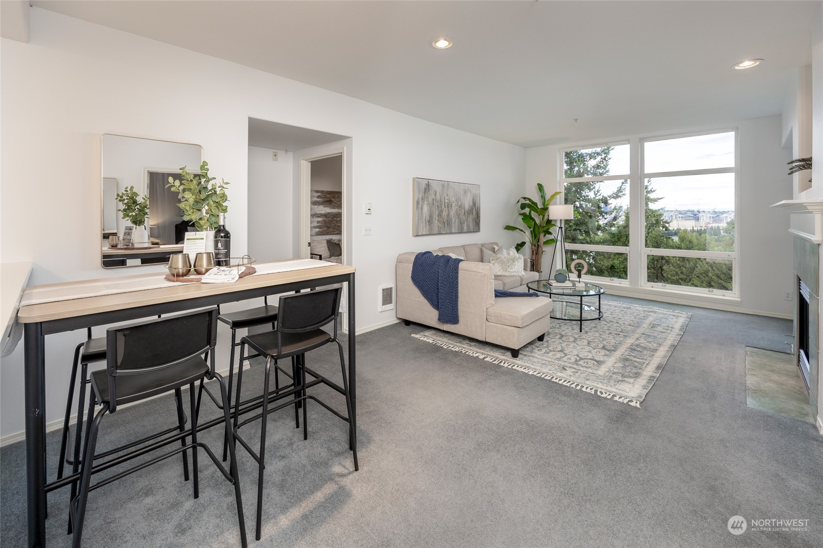 3221 Southwest Avalon Way, Unit 305 Seattle, WA 98126 - Photo 11 of 40 a living room with furniture and a table