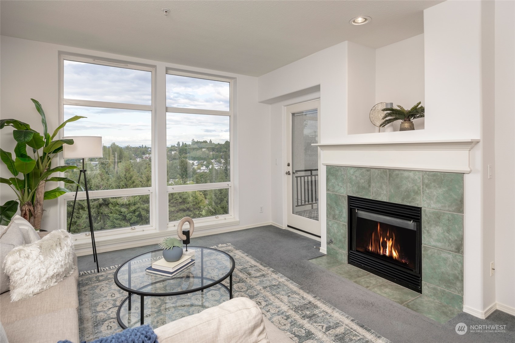 3221 Southwest Avalon Way, Unit 305 Seattle, WA 98126 - Photo 15 of 40 a living room with furniture a window and a fireplace