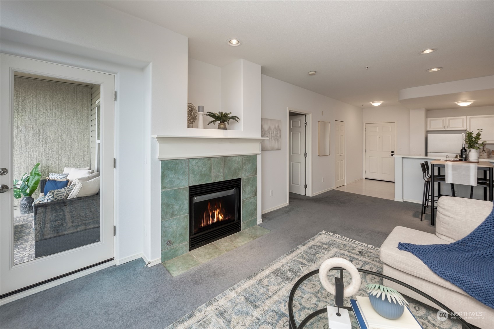 3221 Southwest Avalon Way, Unit 305 Seattle, WA 98126 - Photo 17 of 40 a living room with furniture and a fireplace