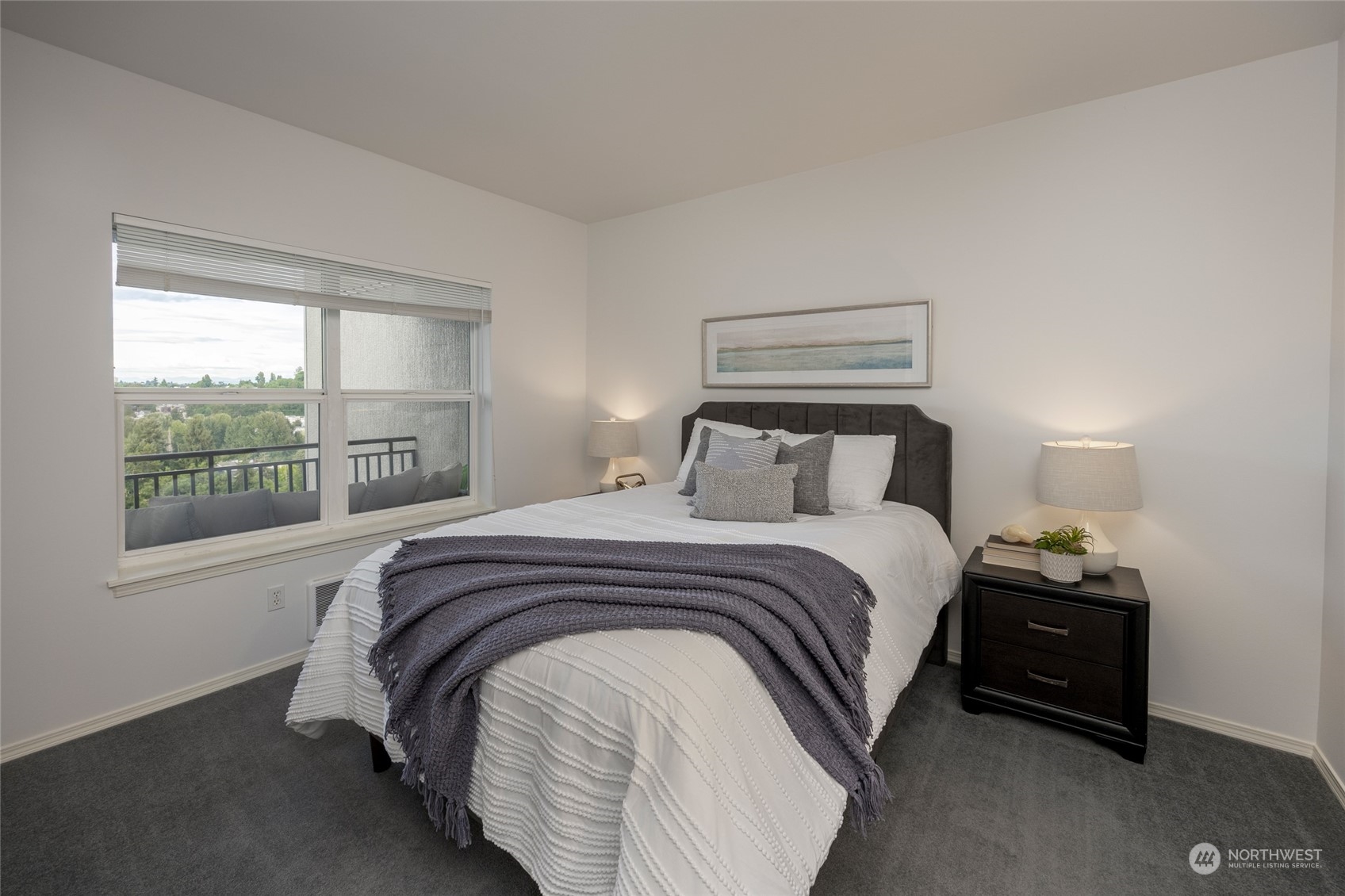 3221 Southwest Avalon Way, Unit 305 Seattle, WA 98126 - Photo 18 of 40 a bedroom with a bed and window