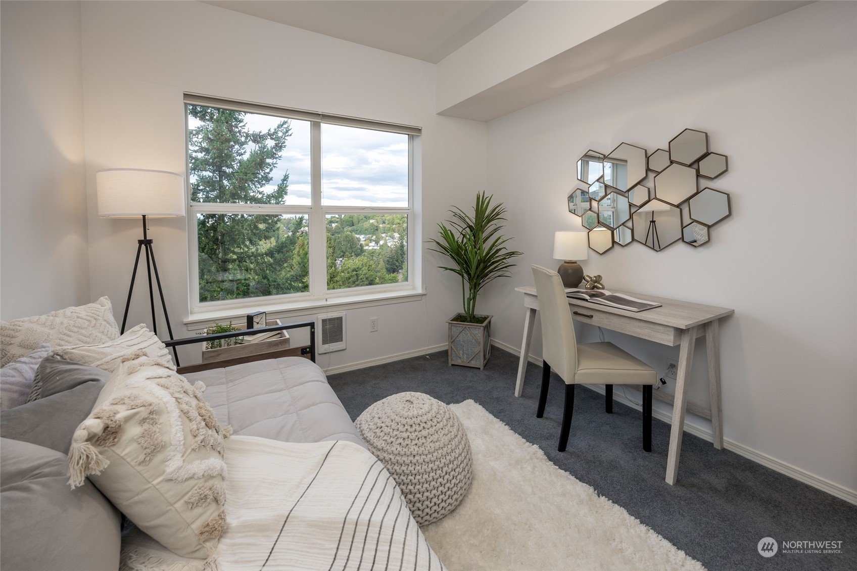 3221 Southwest Avalon Way, Unit 305 Seattle, WA 98126 - Photo 26 of 40 a bedroom with a bed and a window