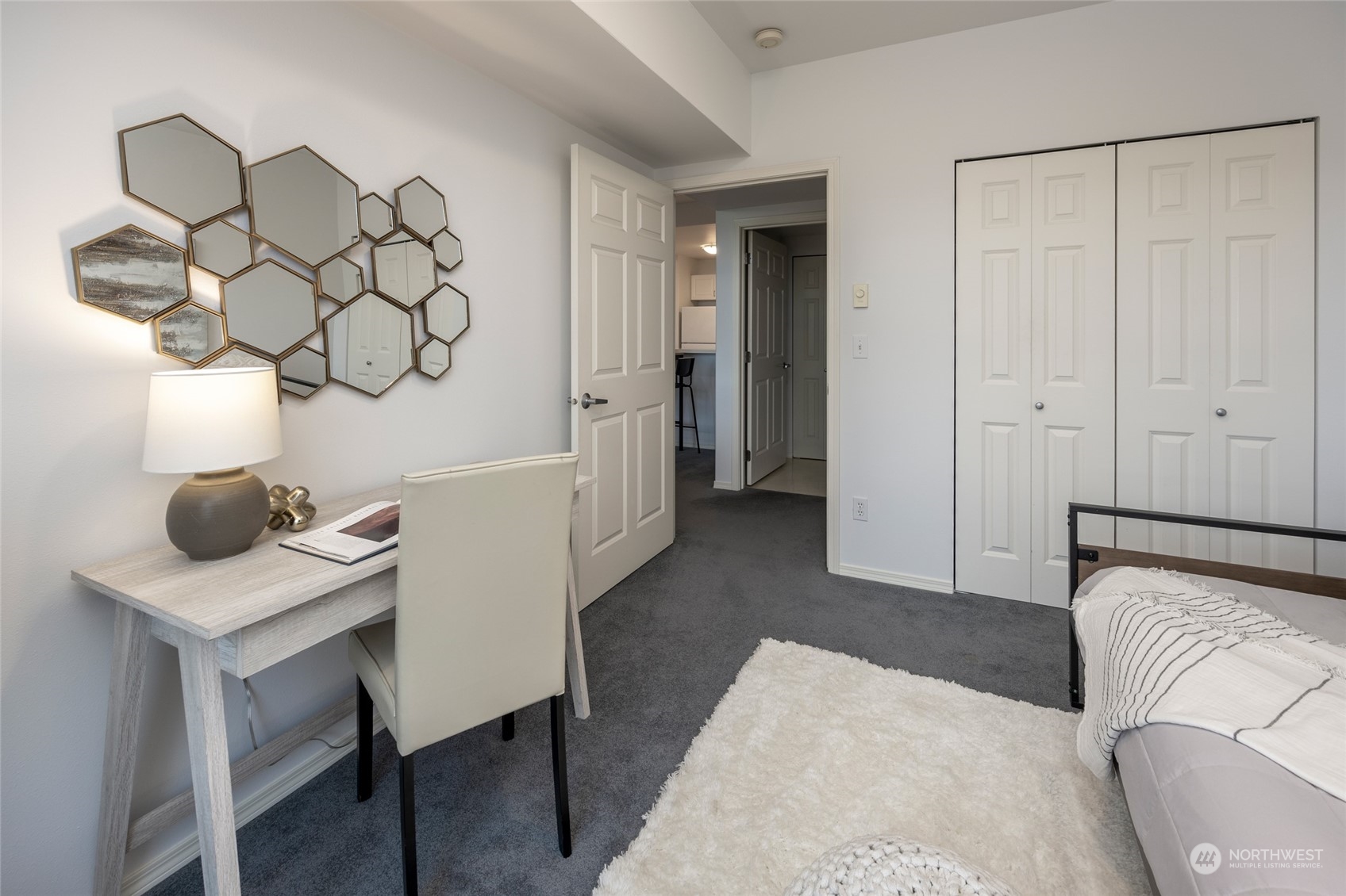 3221 Southwest Avalon Way, Unit 305 Seattle, WA 98126 - Photo 27 of 40 a bedroom with a bed and a table in it