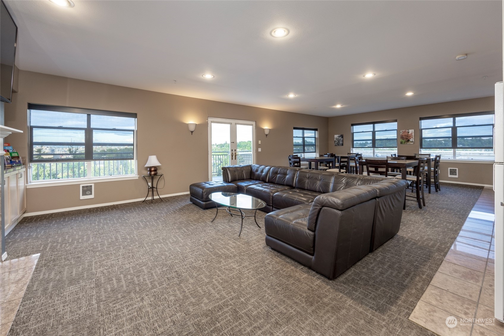 3221 Southwest Avalon Way, Unit 305 Seattle, WA 98126 - Photo 33 of 40 a living room with furniture and a flat screen tv