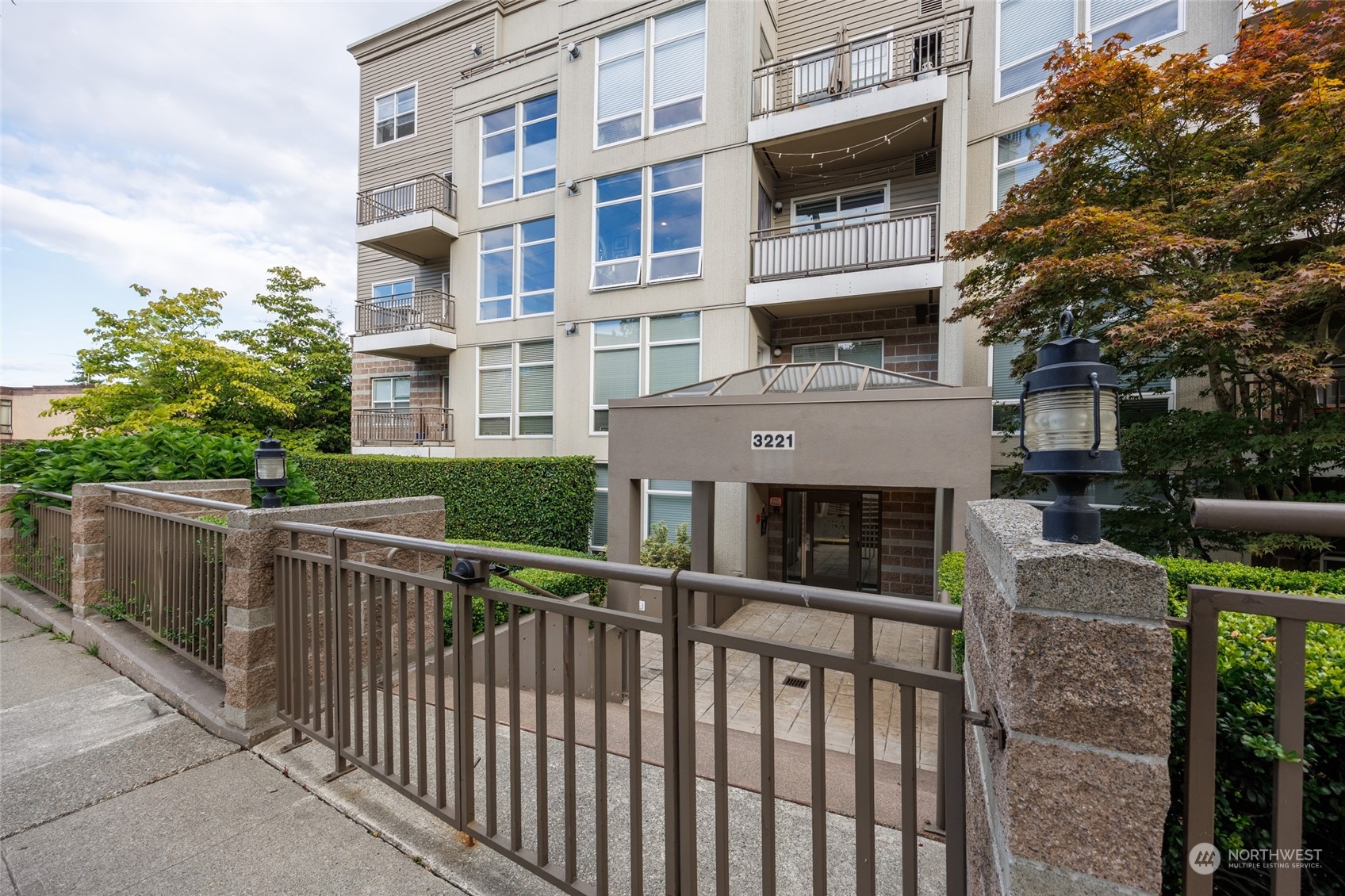 3221 Southwest Avalon Way, Unit 305 Seattle, WA 98126 - Photo 40 of 40 a view of a building with a balcony