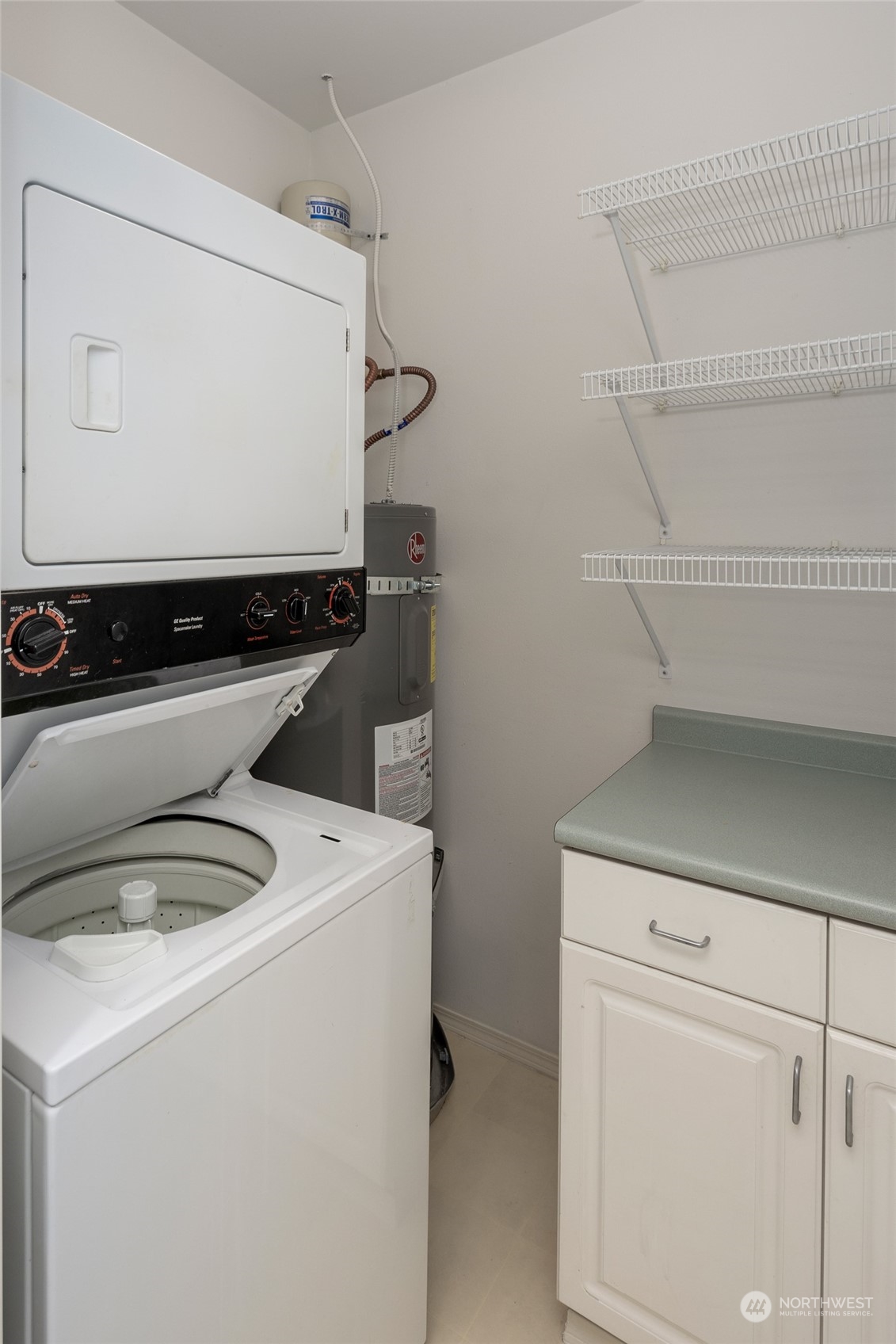 3221 Southwest Avalon Way, Unit 305 Seattle, WA 98126 - Photo 10 of 40 a utility room with dryer and washer