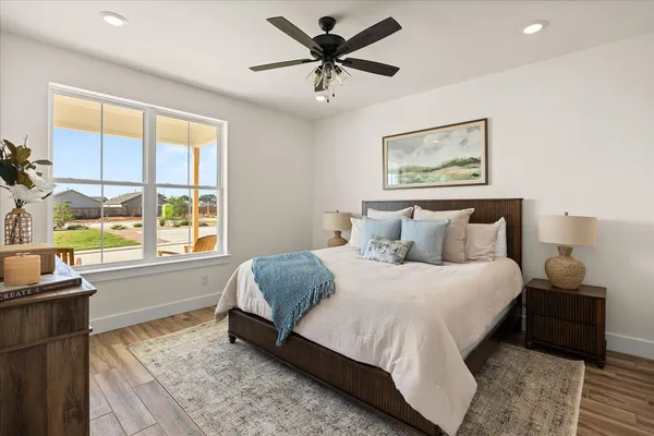 a bedroom with a bed and a window