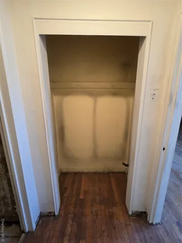 a bathroom with a toilet tub and shower