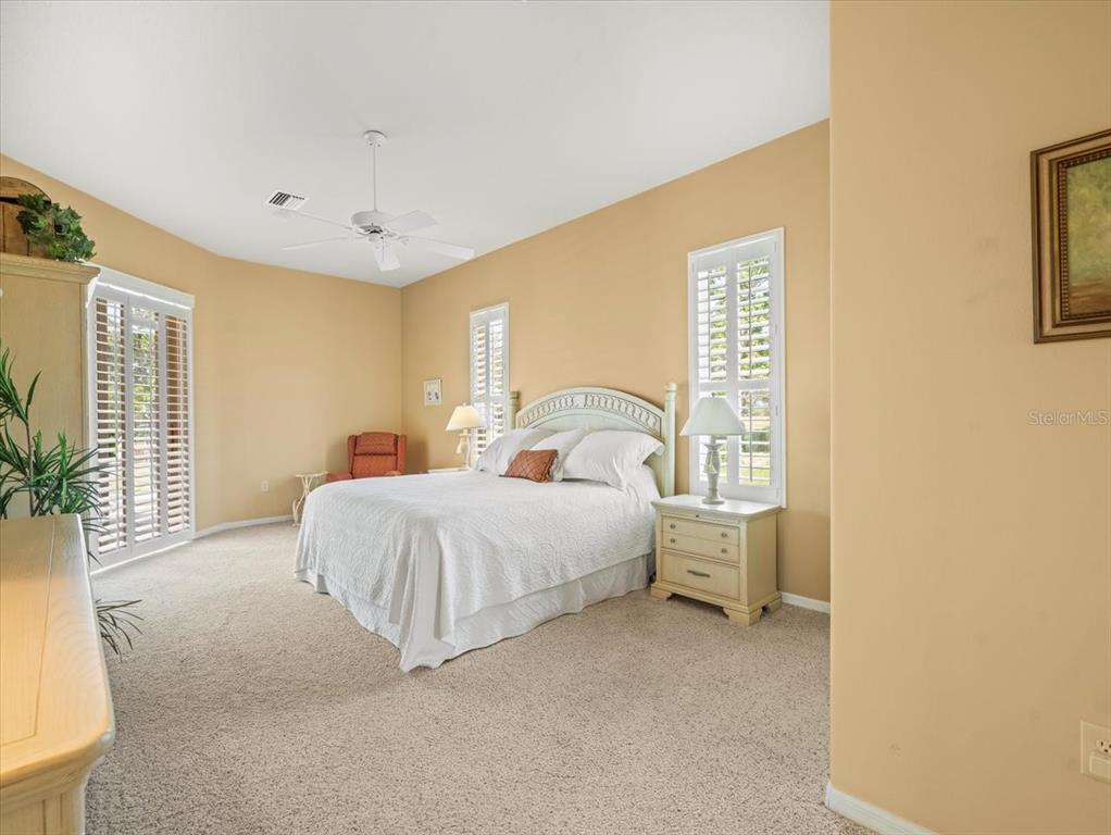 9216 Tarleton Circle Weeki Wachee, FL 34613 - Photo 16 of 66 a spacious bedroom with a bed and a table