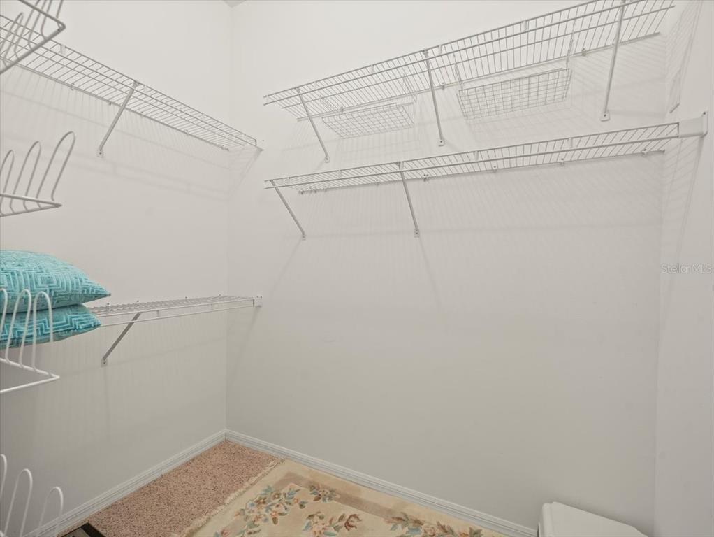 9216 Tarleton Circle Weeki Wachee, FL 34613 - Photo 19 of 66 a view of a room with racks on the wall