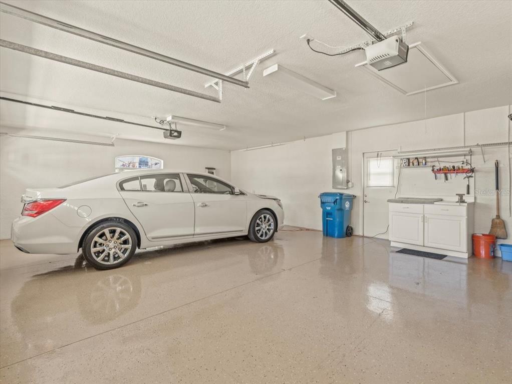 9216 Tarleton Circle Weeki Wachee, FL 34613 - Photo 23 of 66 a view of a garage with storage