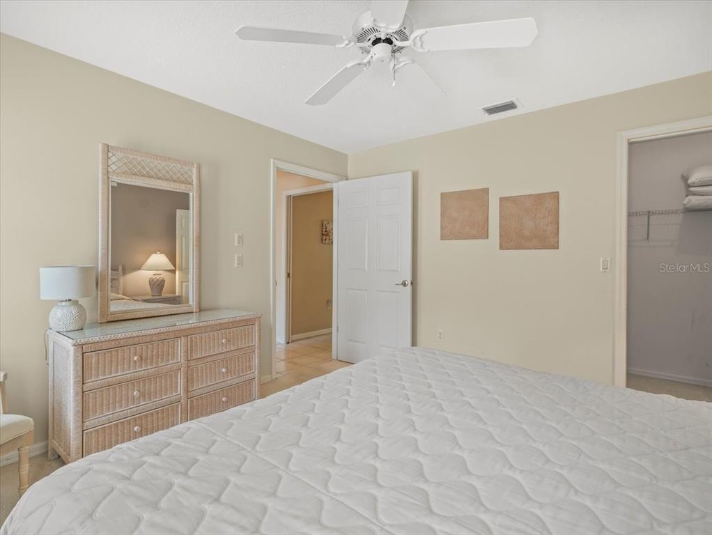 9216 Tarleton Circle Weeki Wachee, FL 34613 - Photo 25 of 66 a bedroom with a bed and a dresser