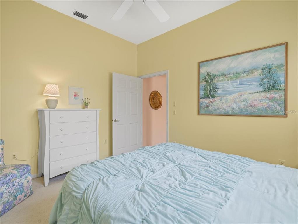 9216 Tarleton Circle Weeki Wachee, FL 34613 - Photo 28 of 66 a bedroom with a bed and a cabinets