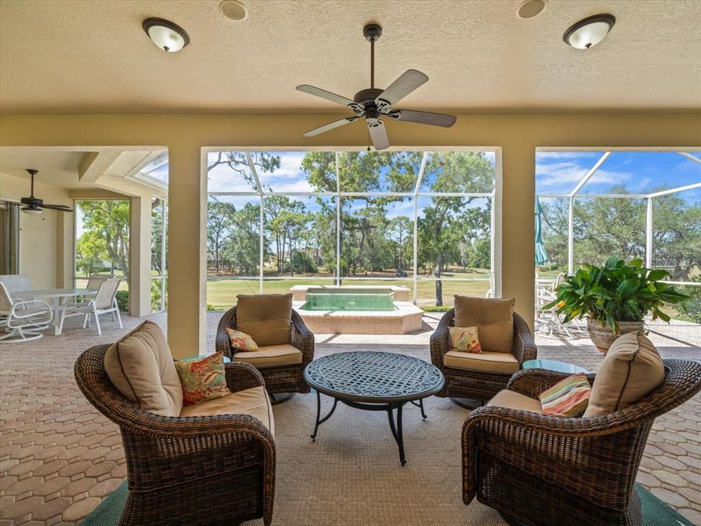 9216 Tarleton Circle Weeki Wachee, FL 34613 - Photo 42 of 66 a living room with furniture and a large window