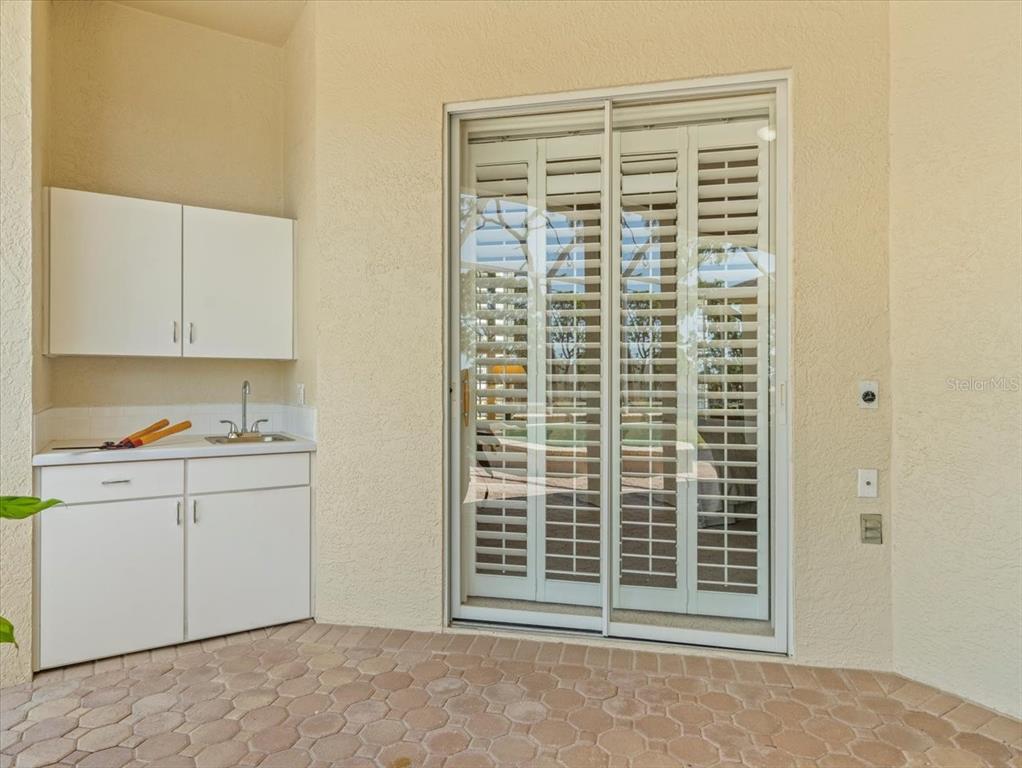 9216 Tarleton Circle Weeki Wachee, FL 34613 - Photo 45 of 66 a view of a kitchen with dishwasher and white cabinets