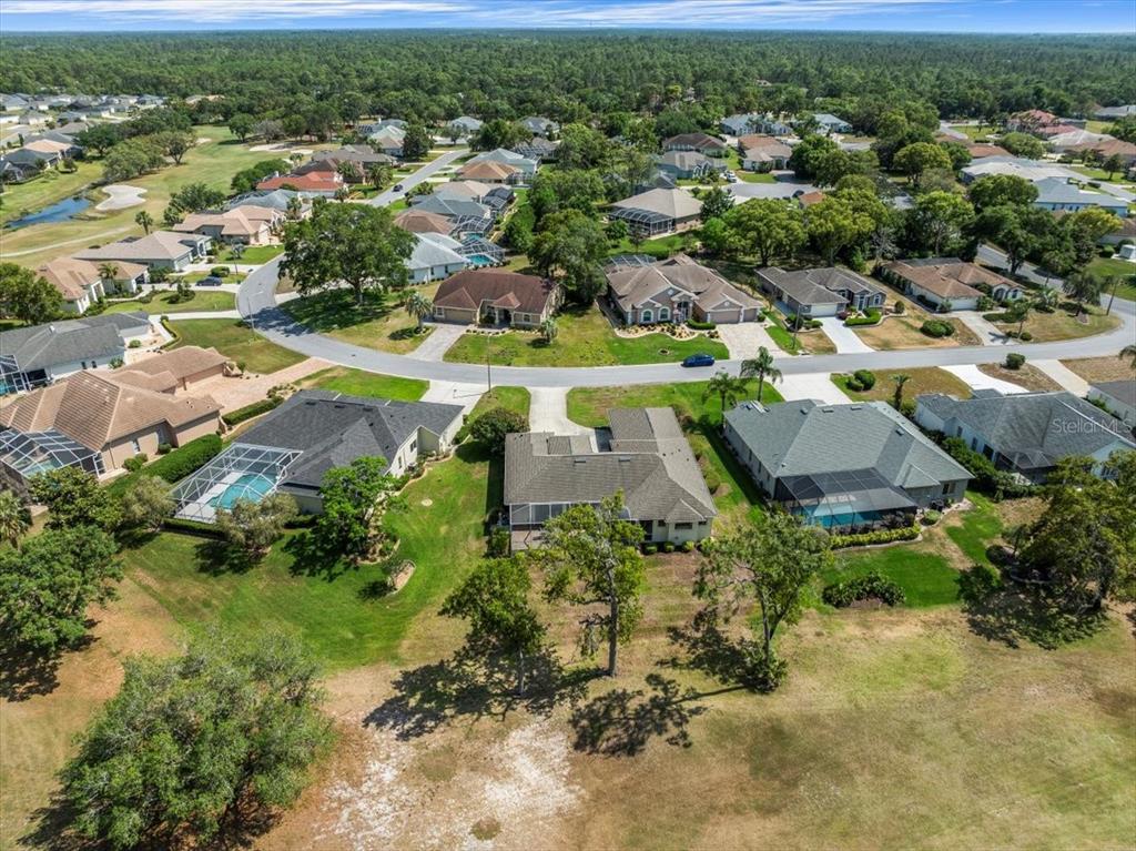 9216 Tarleton Circle Weeki Wachee, FL 34613 - Photo 59 of 66 an aerial view of residential houses with outdoor space and trees