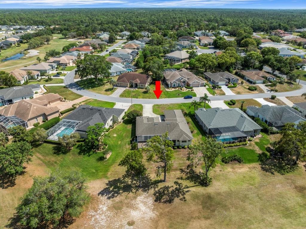 9216 Tarleton Circle Weeki Wachee, FL 34613 - Photo 65 of 66 an aerial view of residential houses with outdoor space and trees