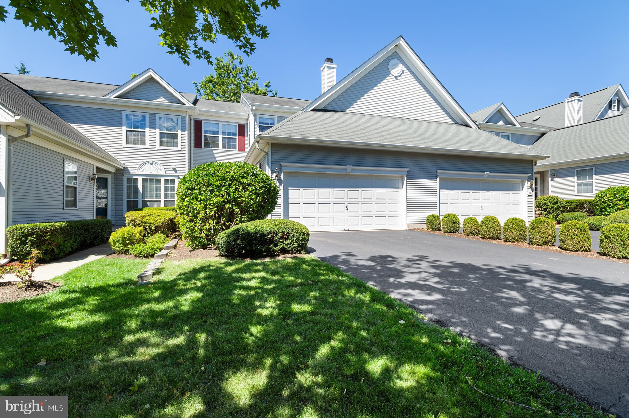 339 Watkins Road Pennington, NJ 08534 - Photo 1 of 32 a front view of a house with a yard and garage